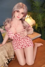 Golden sex doll Lena showing platinum blonde hair and heart dress