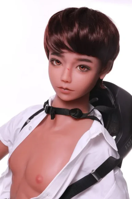 muscular male doll sitting on bed in casual shorts