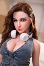 sex ai doll Nora sitting on bed in denim outfit
