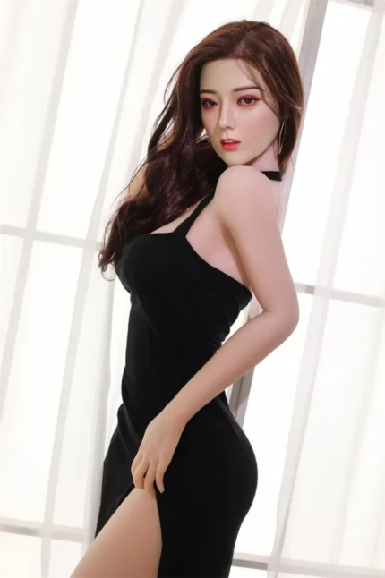 human size sex doll standing tall with soft brunette hair and smooth skin